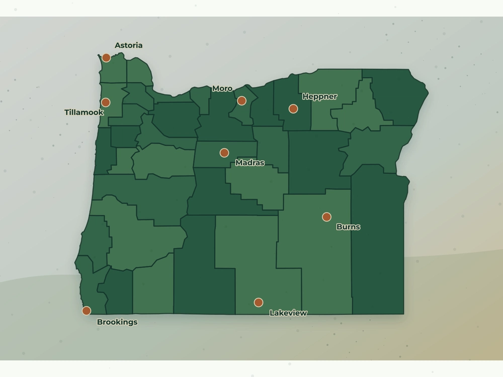 Accurate Oregon land service area map showing Astoria, Tillamook, Brookings, Burns, Madras, Lakeview, Heppner, and Moro